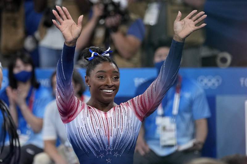 Biles returns to competition with a bronze medal and a smile