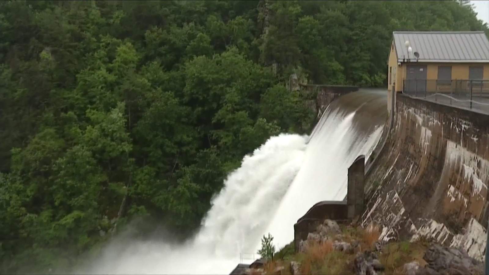 Officials say no danger to public as two feet of water flow over Carvins Cove dam