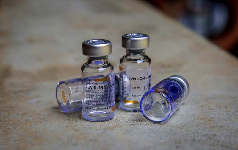 The Latest: Fauci addresses vaccine hesitancy