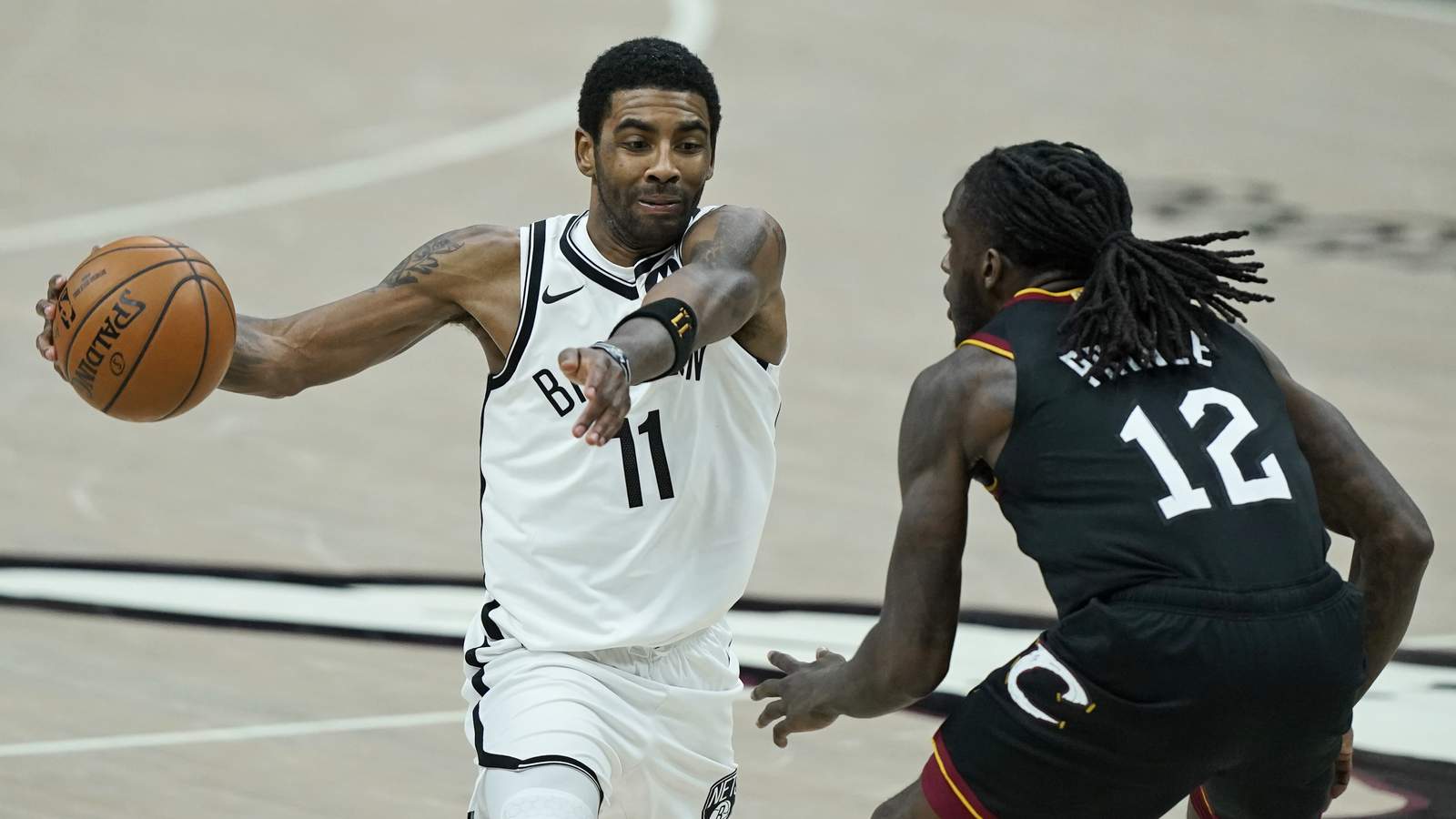 Irving returns, but new-look Nets beaten by Cavs in 2 OTs