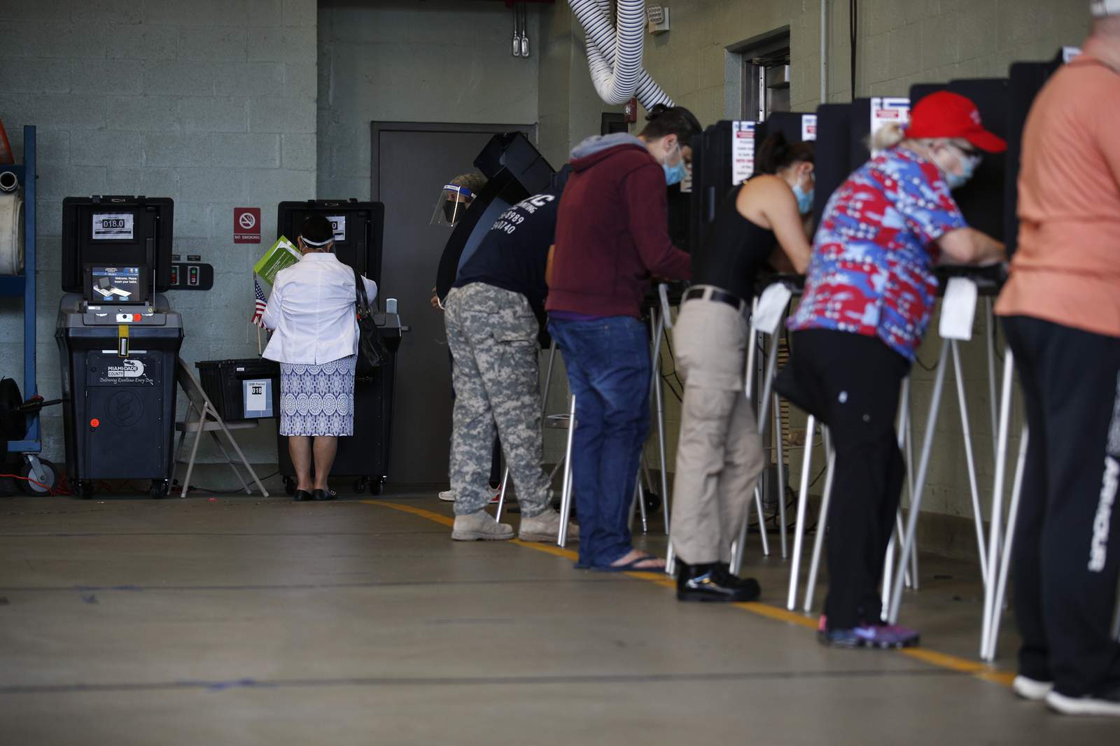 AP VoteCast: Voters split on virus, economy, even football