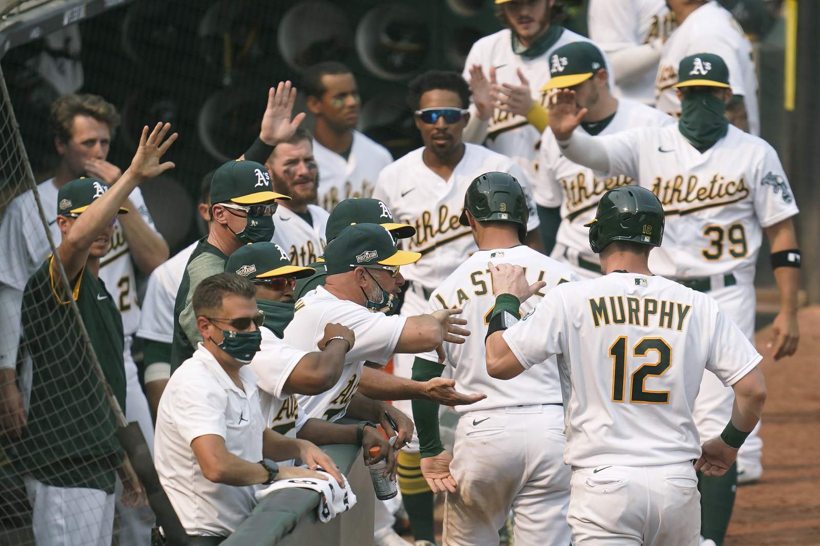Pinder delivers timely hit, A's advance in playoffs at last