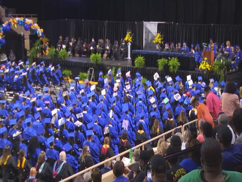 William Fleming seniors hold diplomas high a day after shooting during their graduation practice