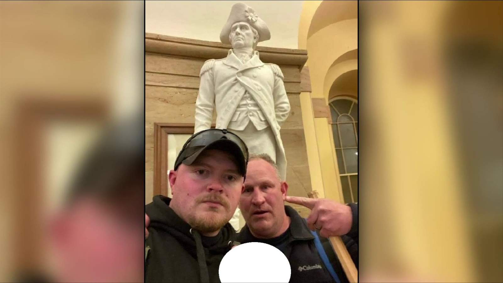 Photo surfaces showing two Rocky Mount policemen inside the Capitol on Wednesday