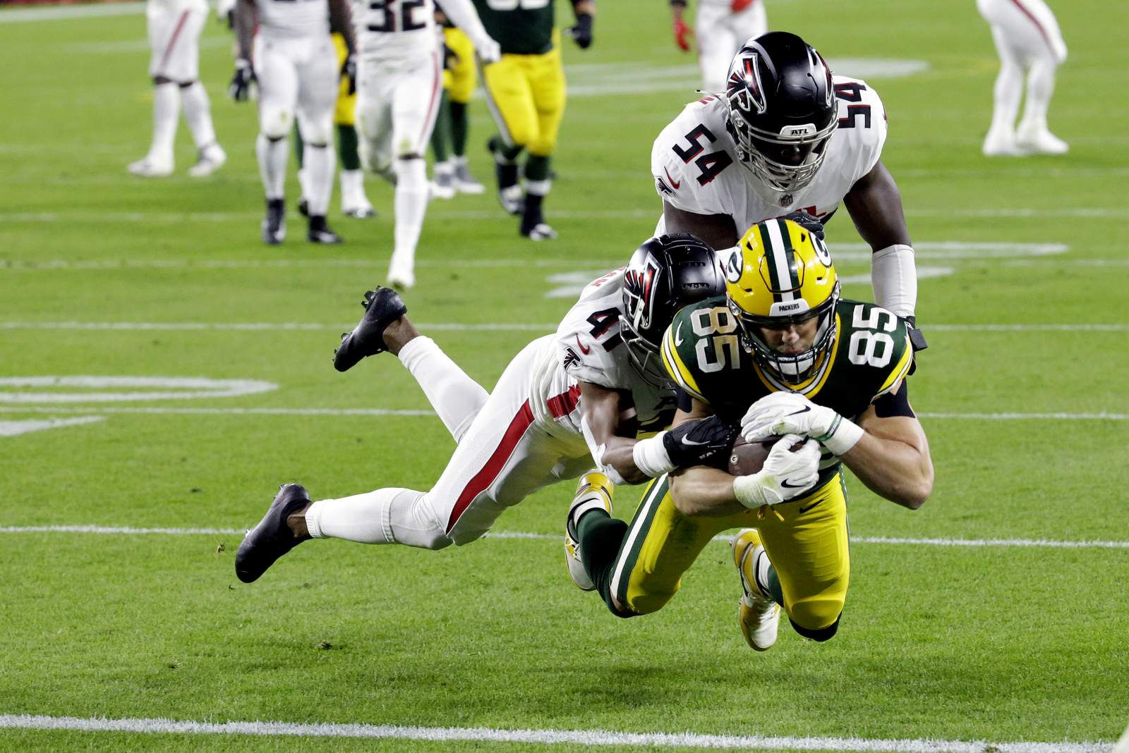 Rodgers, Tonyan lead Packers to 30-16 victory over Falcons