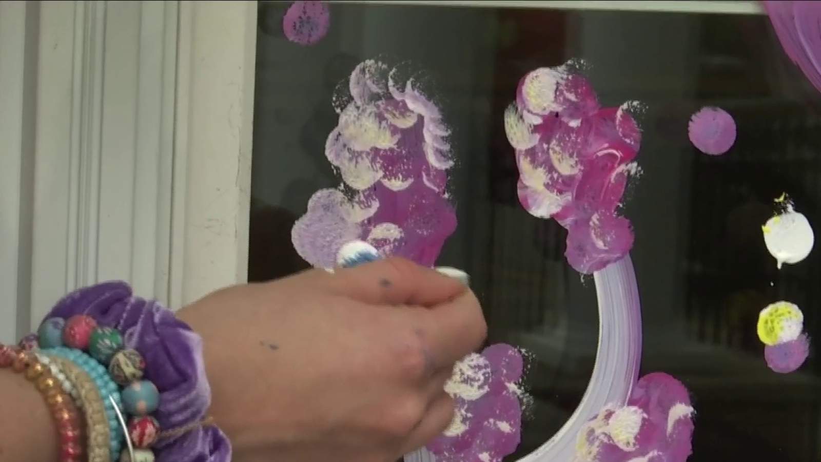 Roanoke Valley volunteers paint nursing home windows to spread cheer