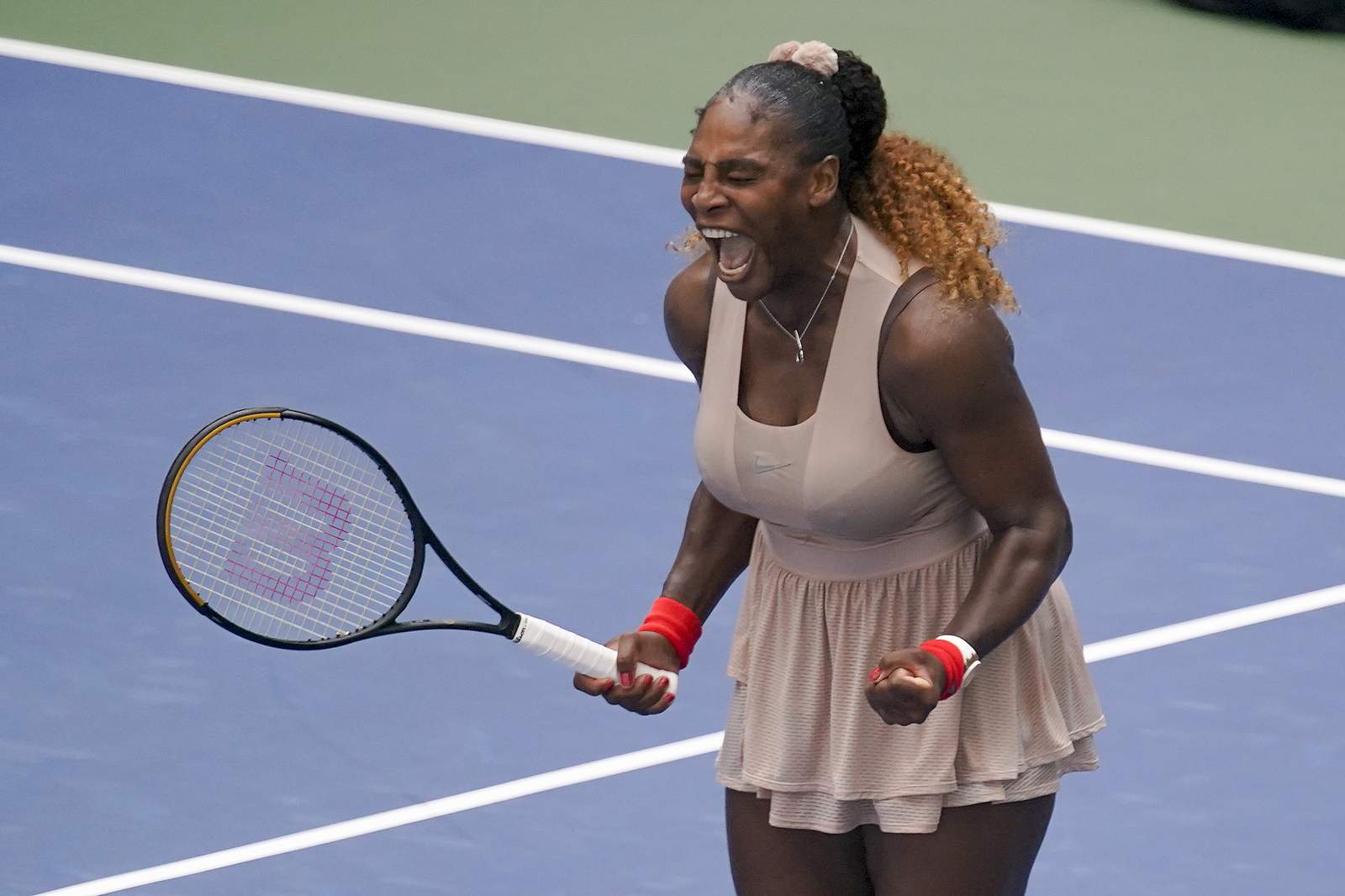 Down but not out, Serena Williams yells herself to Open win