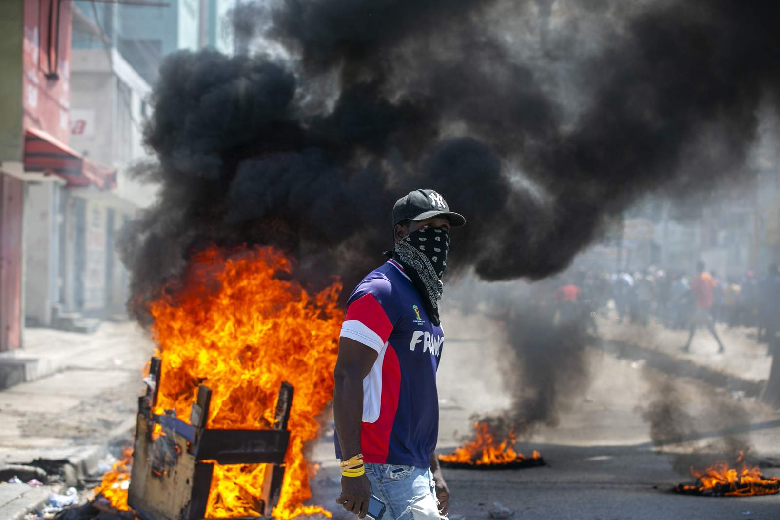 Haitian police, protesters clash; president calls for unity