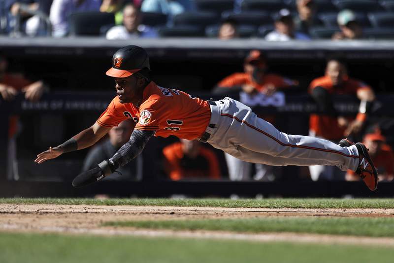 O's rally against Chapman, win after nearly no-hitting Yanks