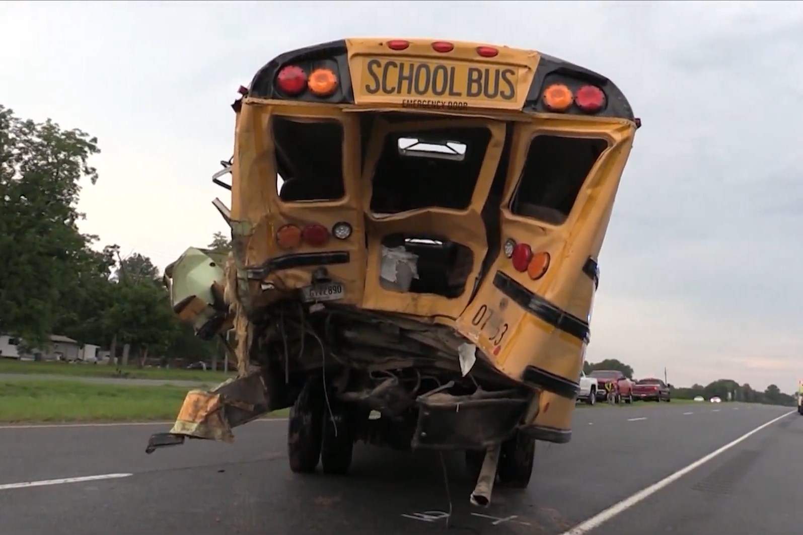 Truck driver in crash with school bus helps free trapped students before he collapses