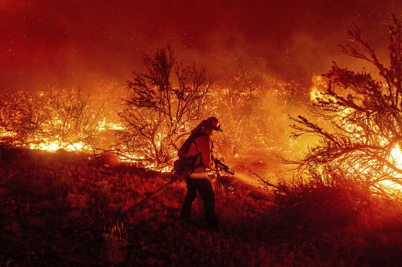 EXPLAINER: Why it takes months to subdue some wildfires