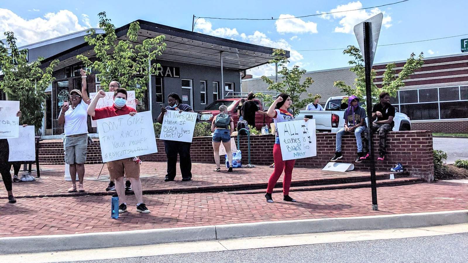 Group protests outside Lynchburg restaurant for its support of Jerry Falwell’s mask tweet