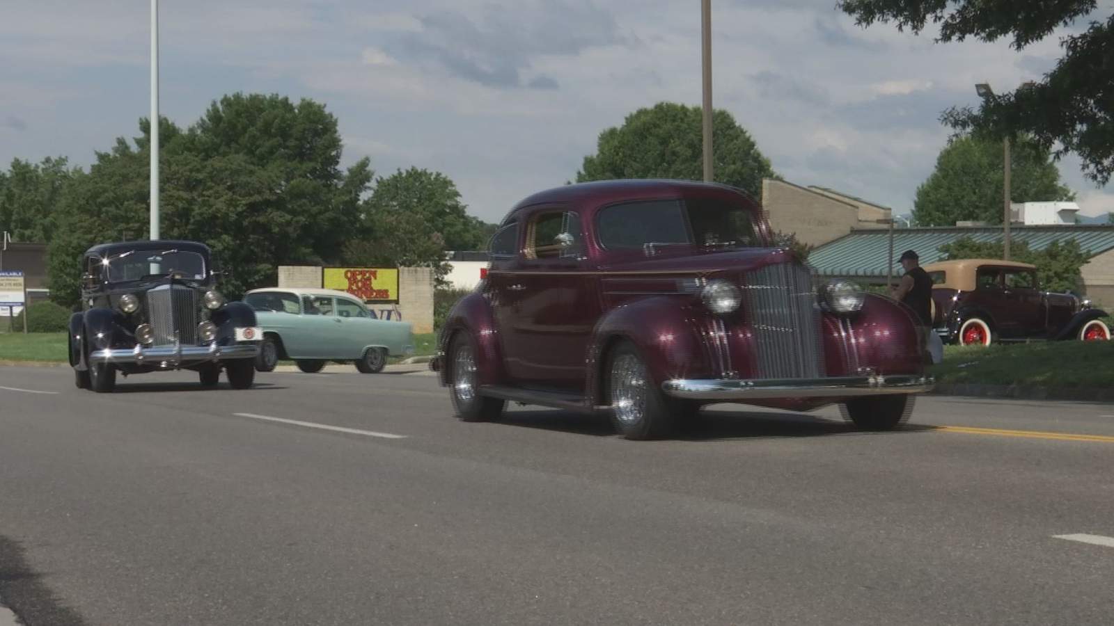 Dozens of car enthusiasts take vintage vehicles for a cruise