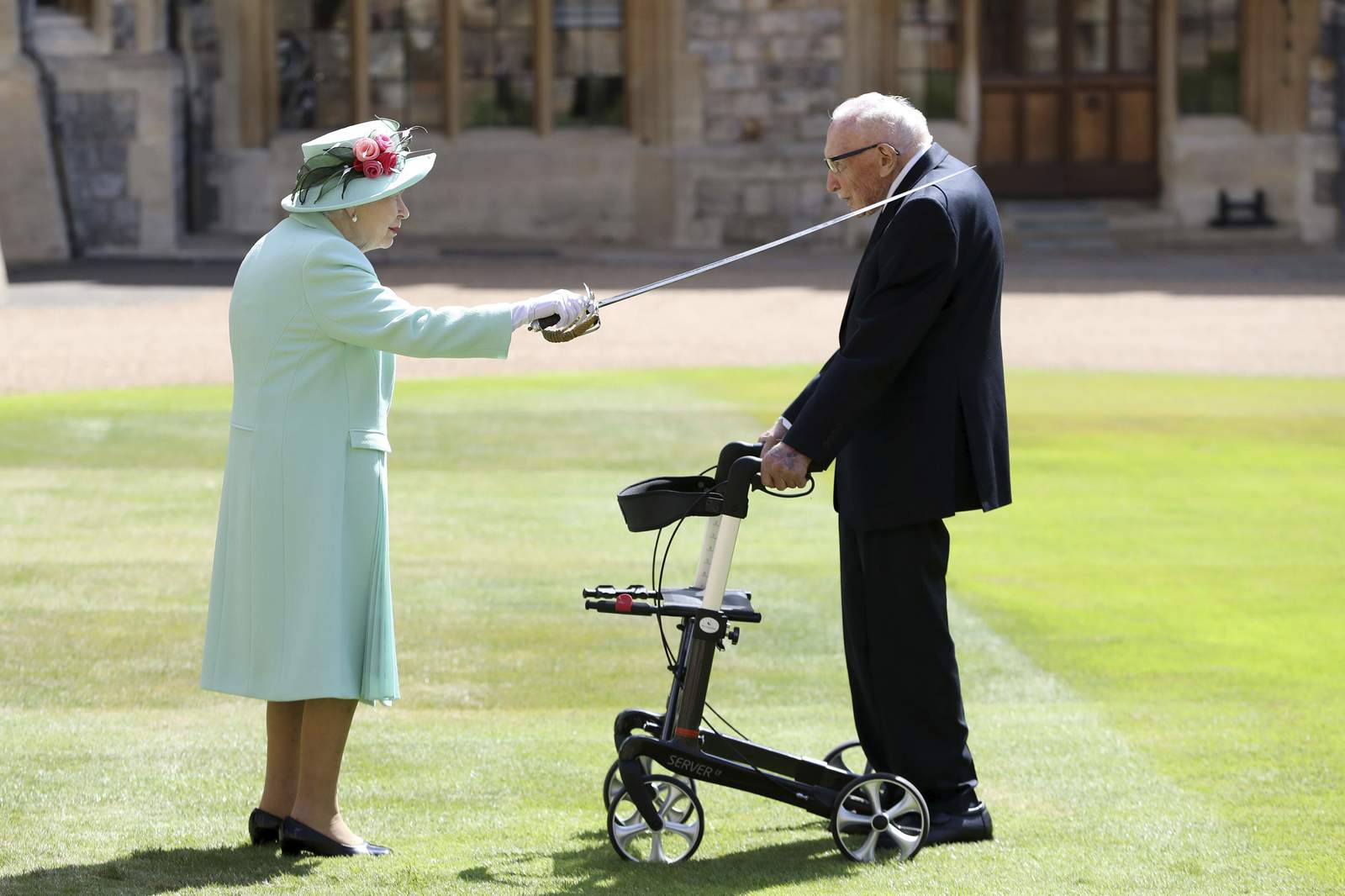 Queen makes veteran a knight at 100; no kneeling required