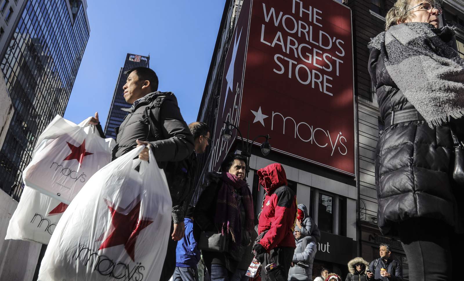 Macy's loses money in 3Q; virus surges into holiday season