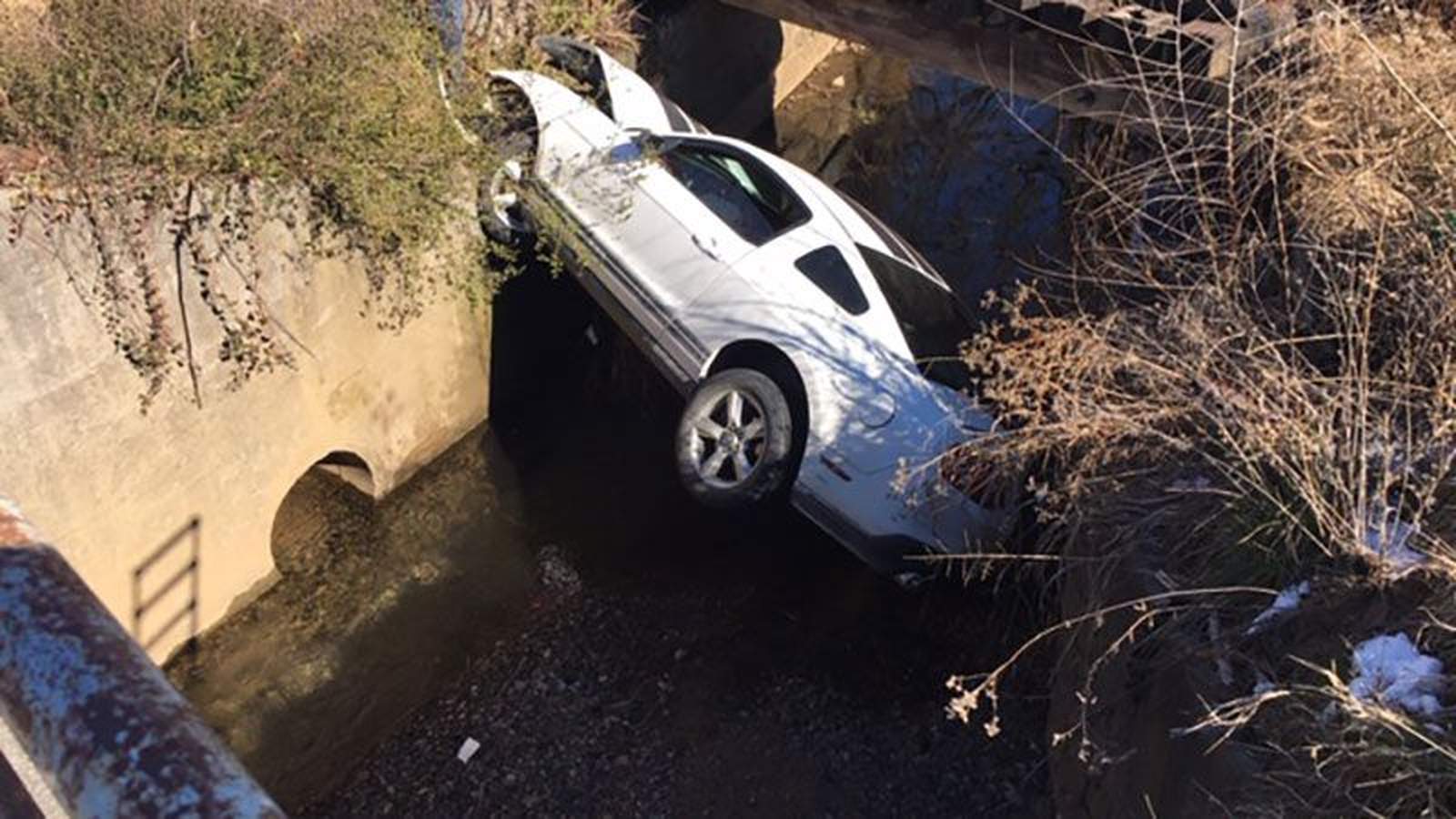 Police chase ends as Mustang lands in Roanoke drainage ditch, police say