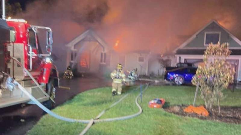 Firefighters say wind helped quickly spread fire at a Smith Mountain Lake home