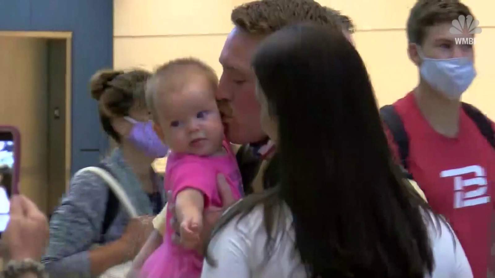 Soldier returns home from overseas to hold his daughter for the first time