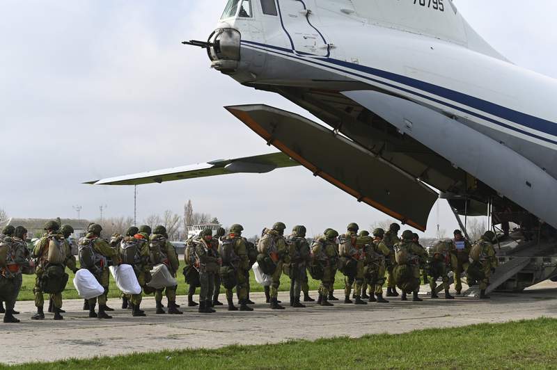 Russia orders troop pullback but keeps weapons near Ukraine