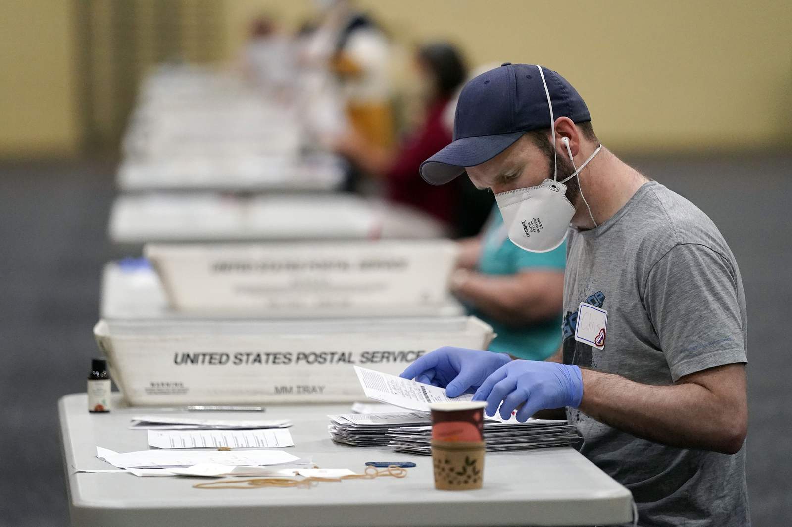 Election officials scramble to count ballots in key states