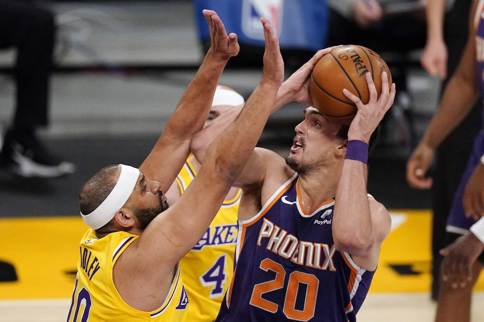 Suns overcome Booker's ejection, hold off Lakers 114-104