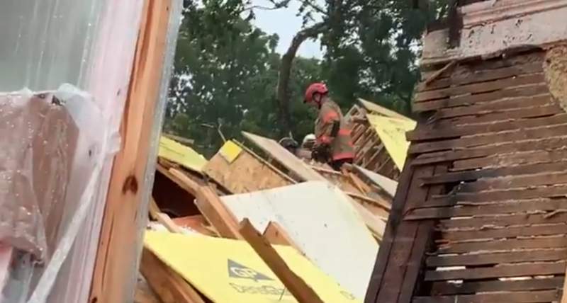 Rescuers trying to free worker trapped in DC home collapse