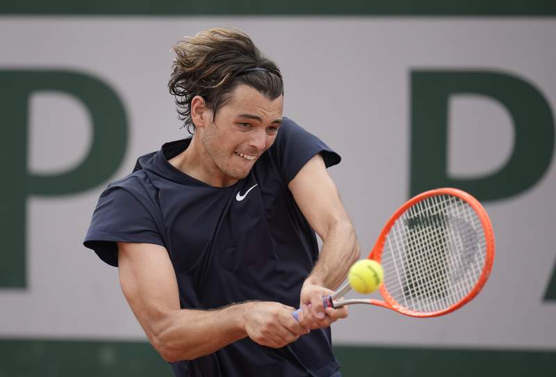 The Latest: A weary Badosa beats Bogdan after nearly 3 hours
