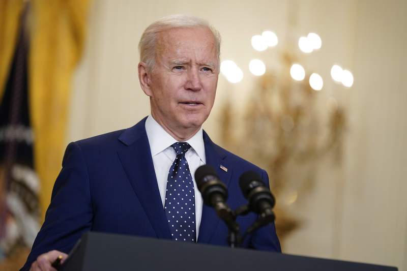 AP sources: Biden to pledge halving greenhouse gases by 2030