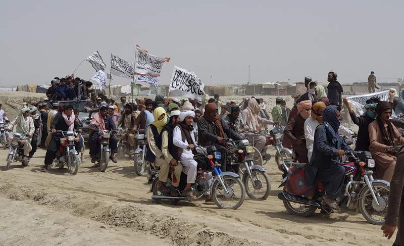 Taliban press advances, take key border post with Pakistan