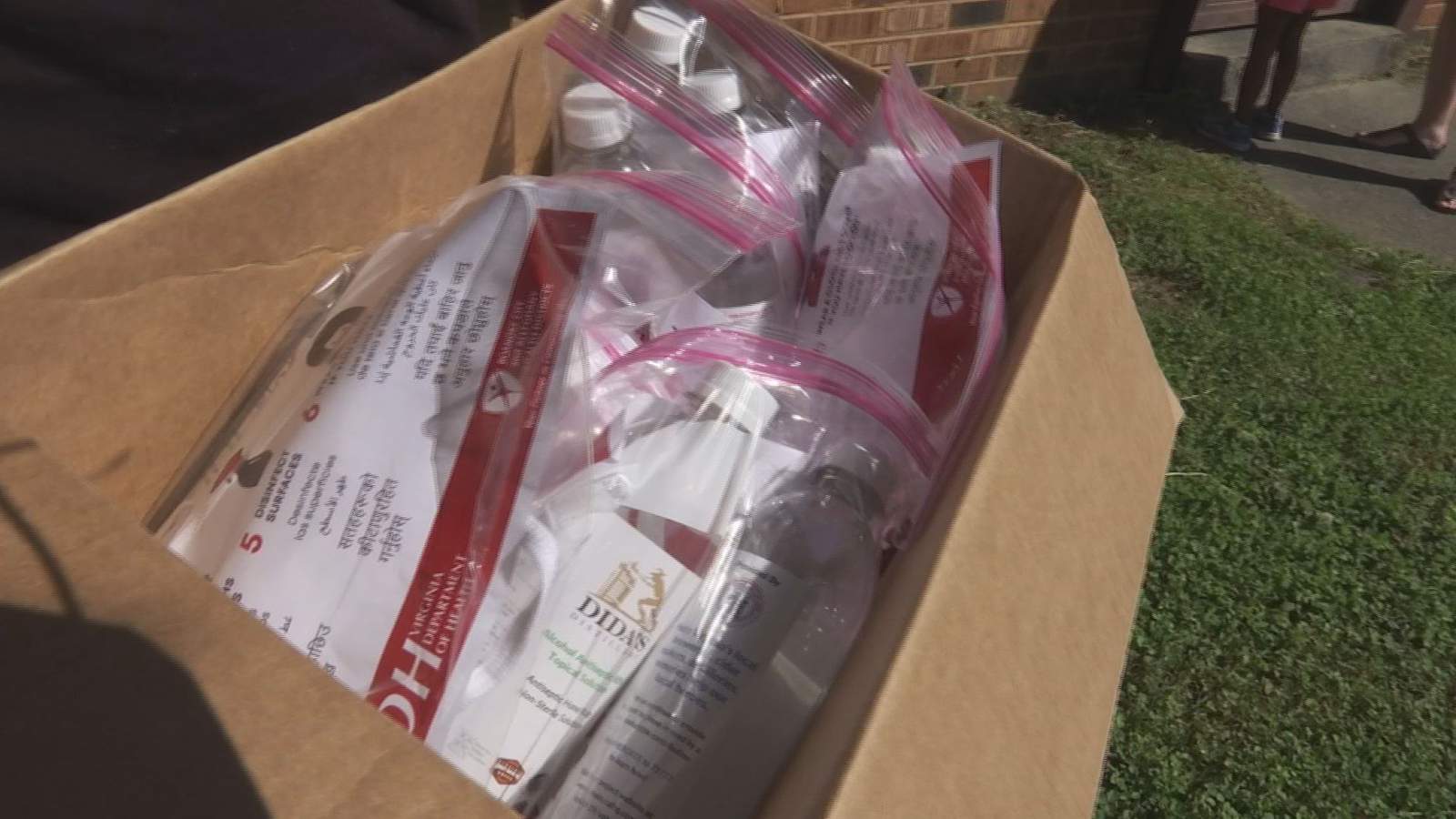 Volunteers hand out masks to Roanoke public housing residents