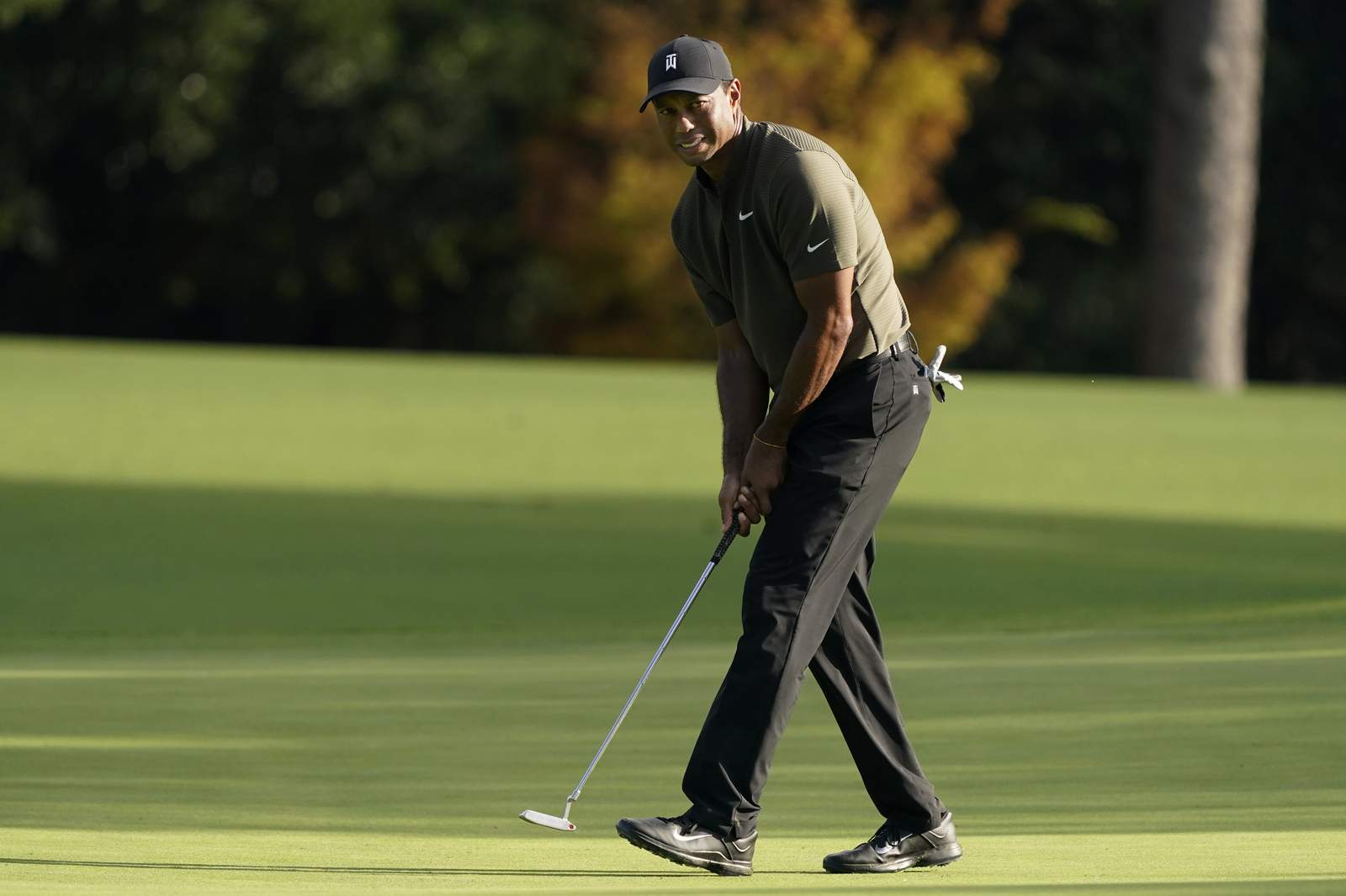 The Latest: Woods off to bogey-free start in Masters defense