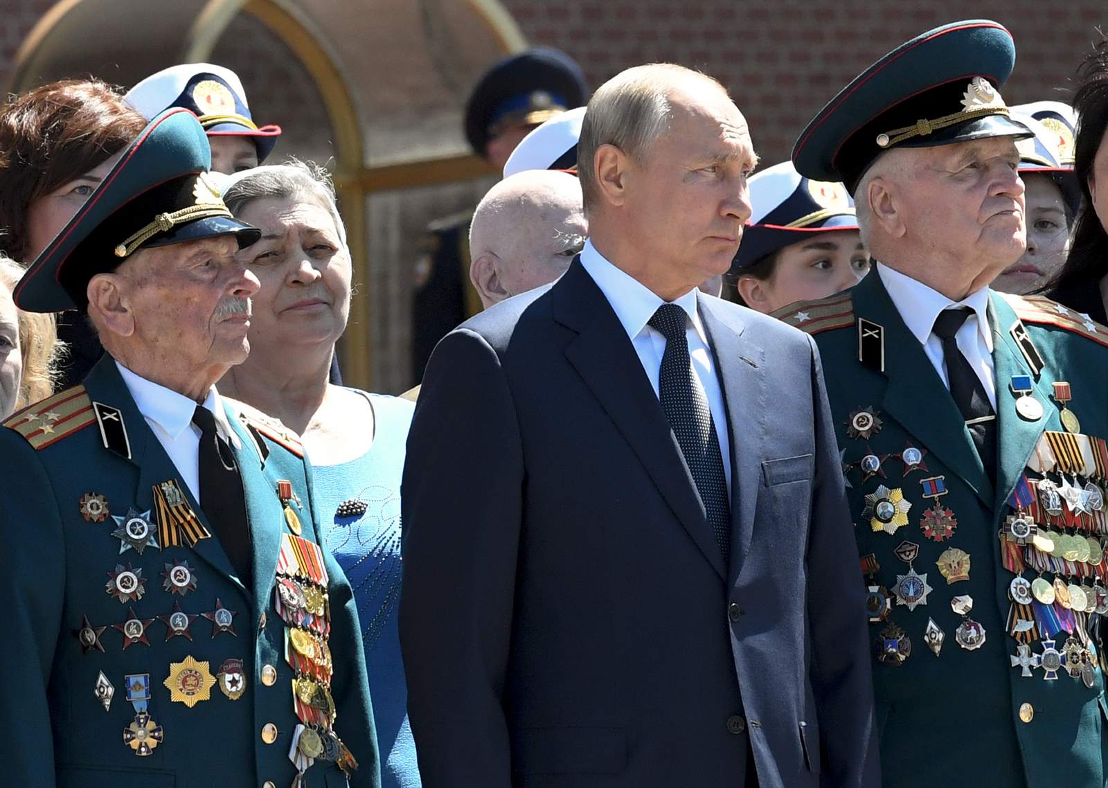 Putin meets with World War II veterans, visits church
