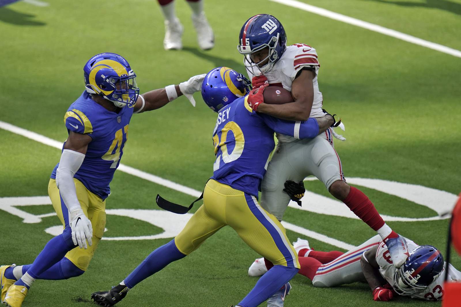 Rams hold off Giants 17-9; Ramsey, Tate fight after game