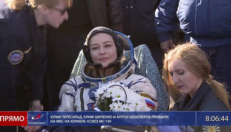 Russian filmmakers land after shoot aboard space station