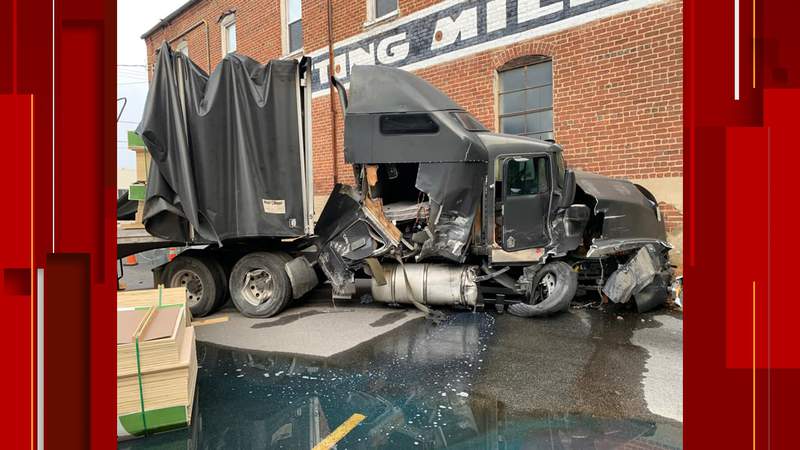 Tractor-trailer crashes into Chatham Knitting Mills building