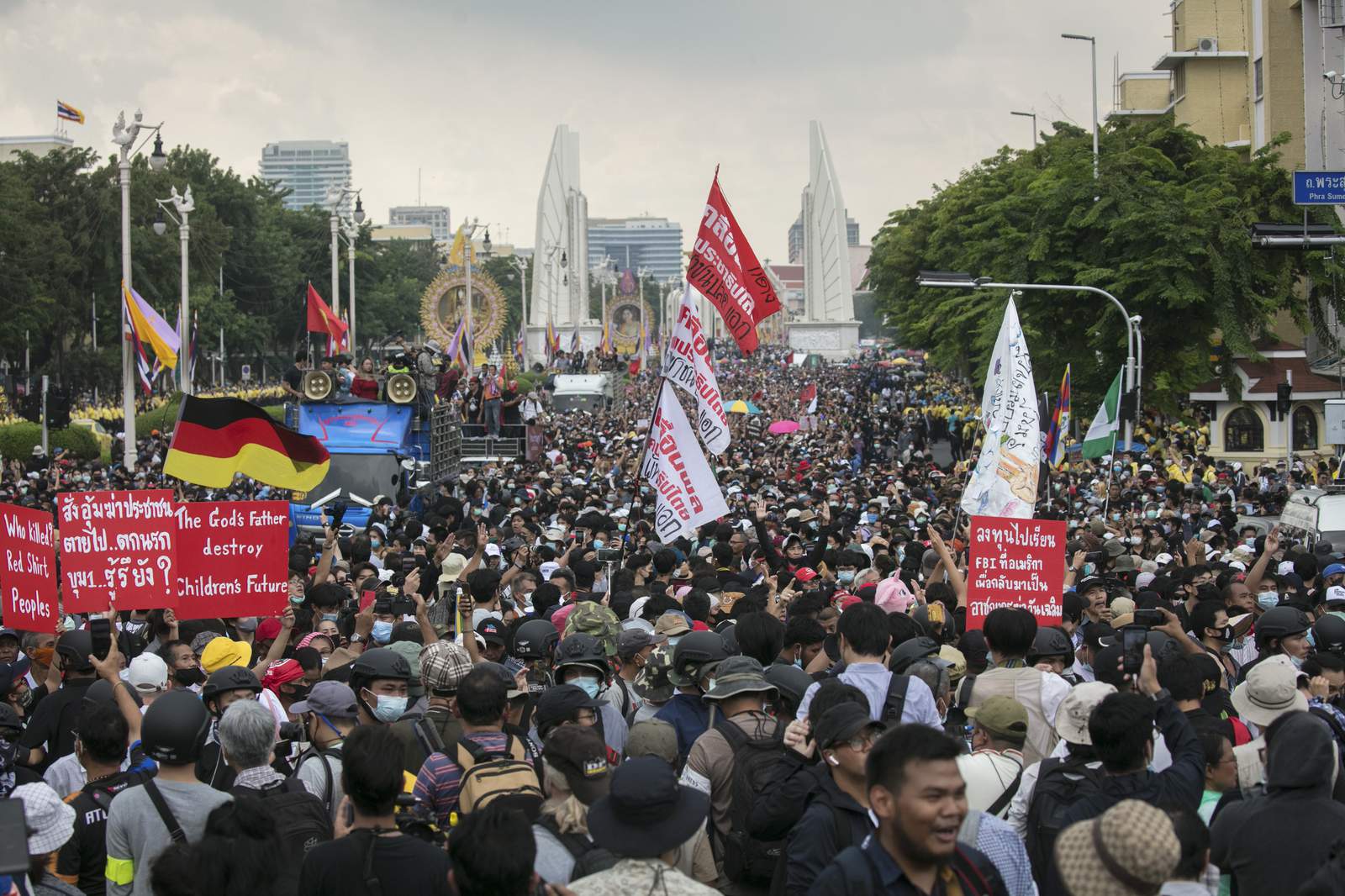 Thai democracy protesters march despite police, rival groups