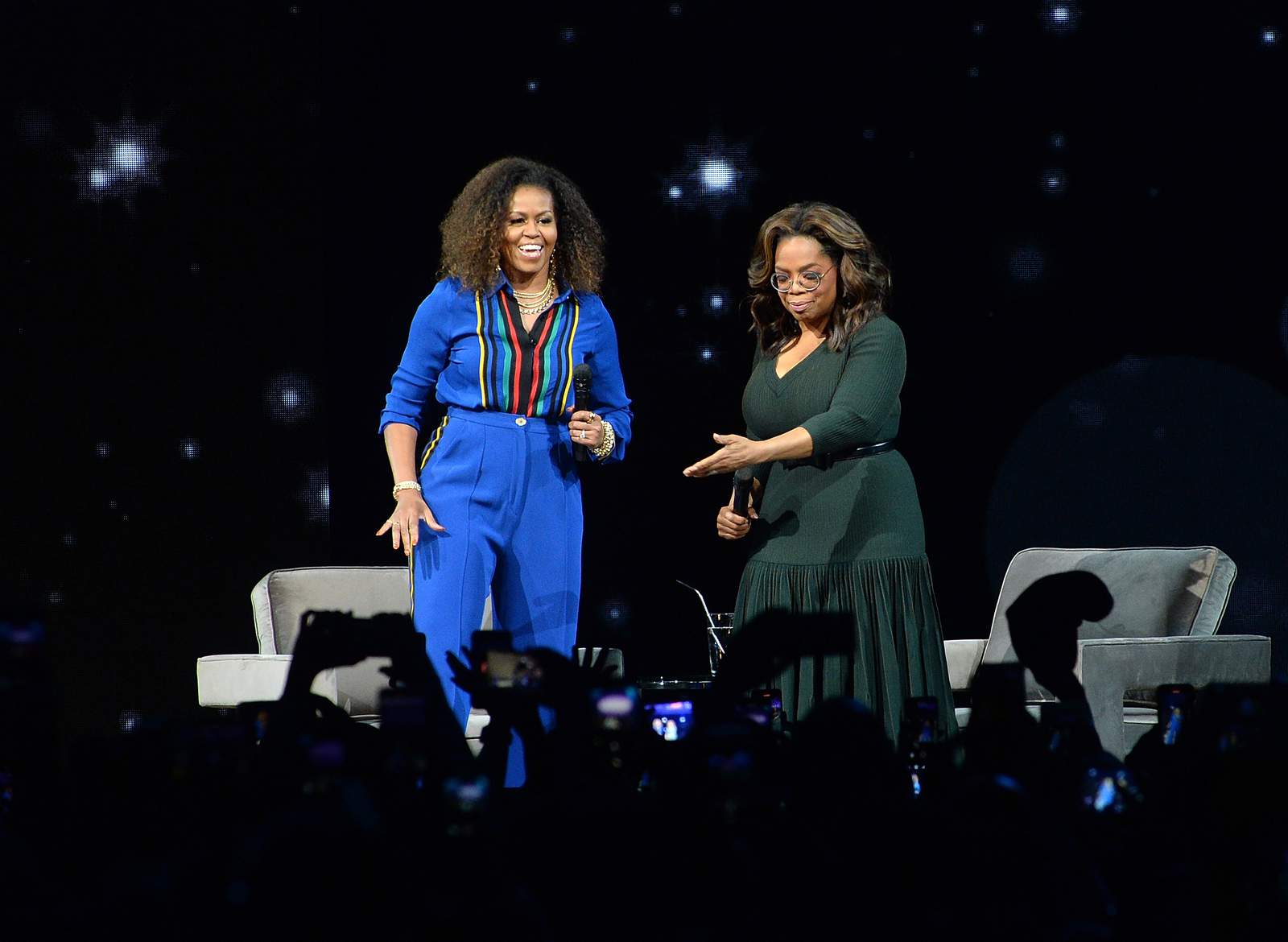Michelle Obama, Oprah Winfrey headline arena like rock stars