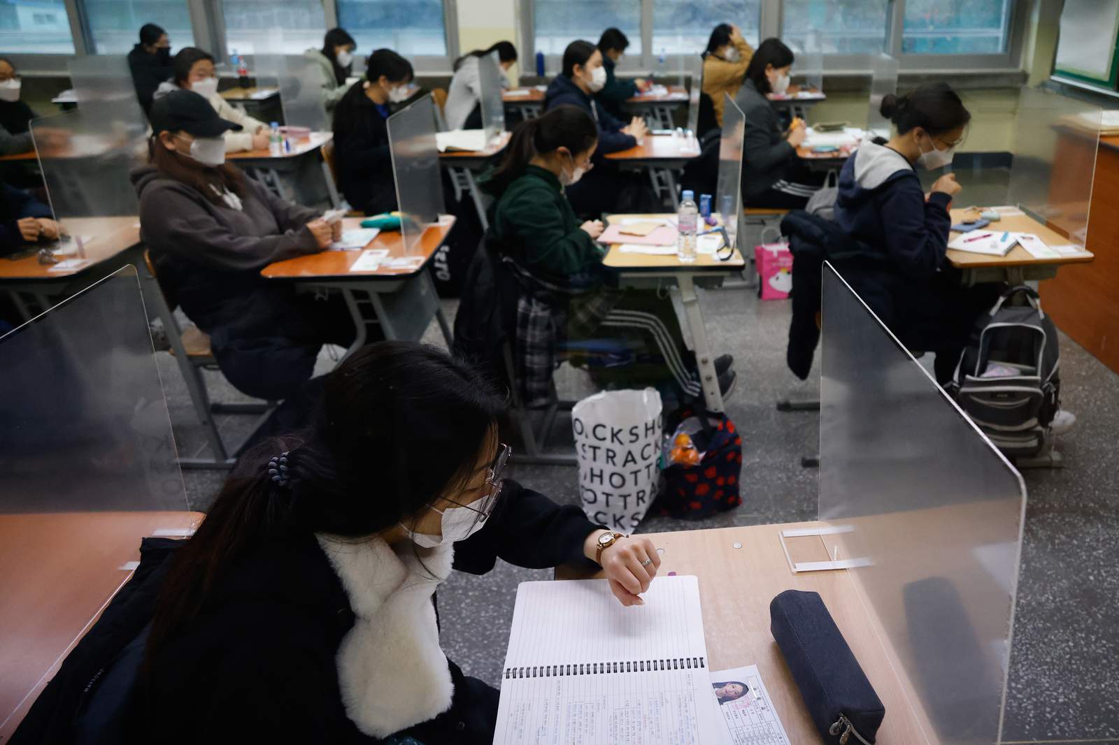 The Latest: Young S. Koreans taking crucial university exam