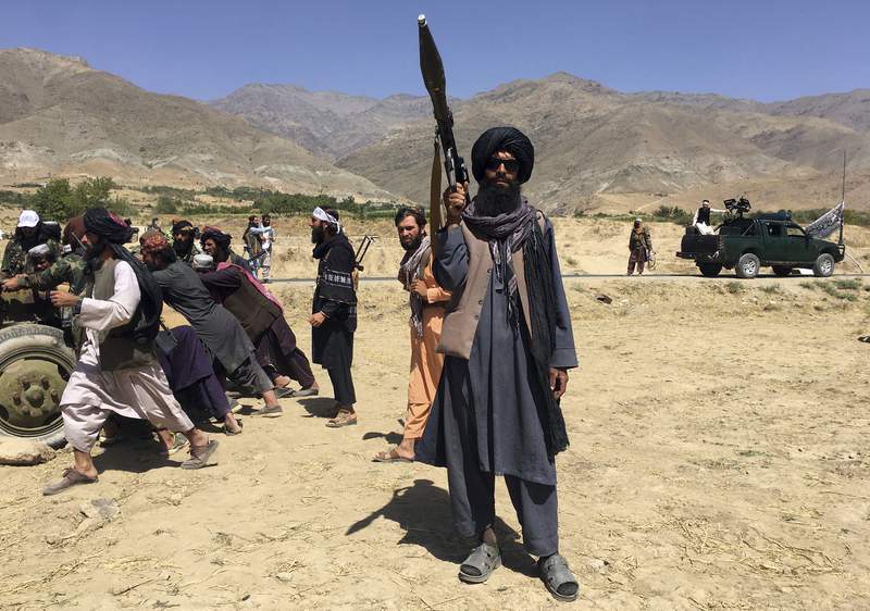 The Latest: Taliban flag flies at Afghan presidential palace