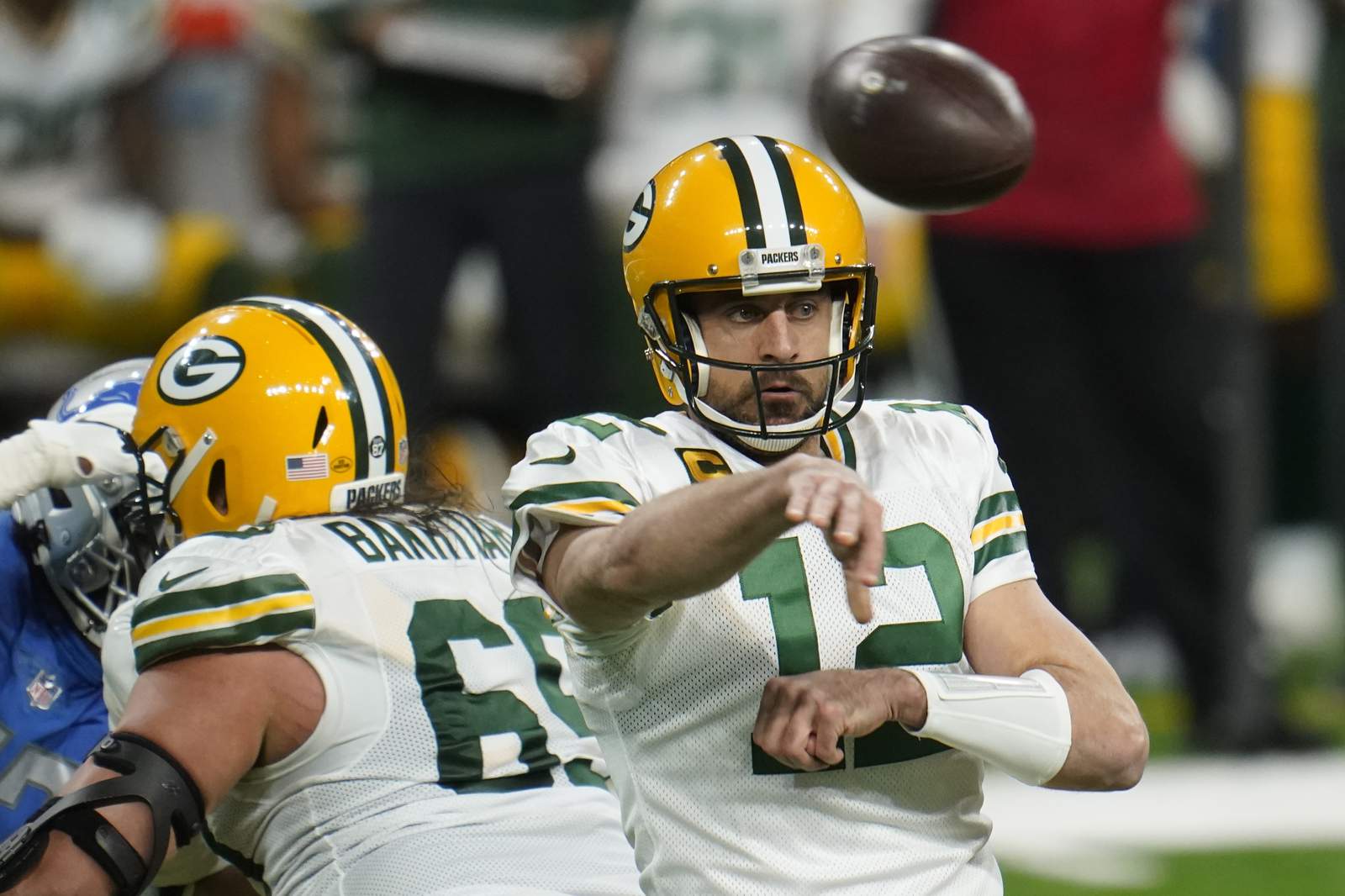 Rodgers-led Packers beat Lions 31-24, clinch NFC North title