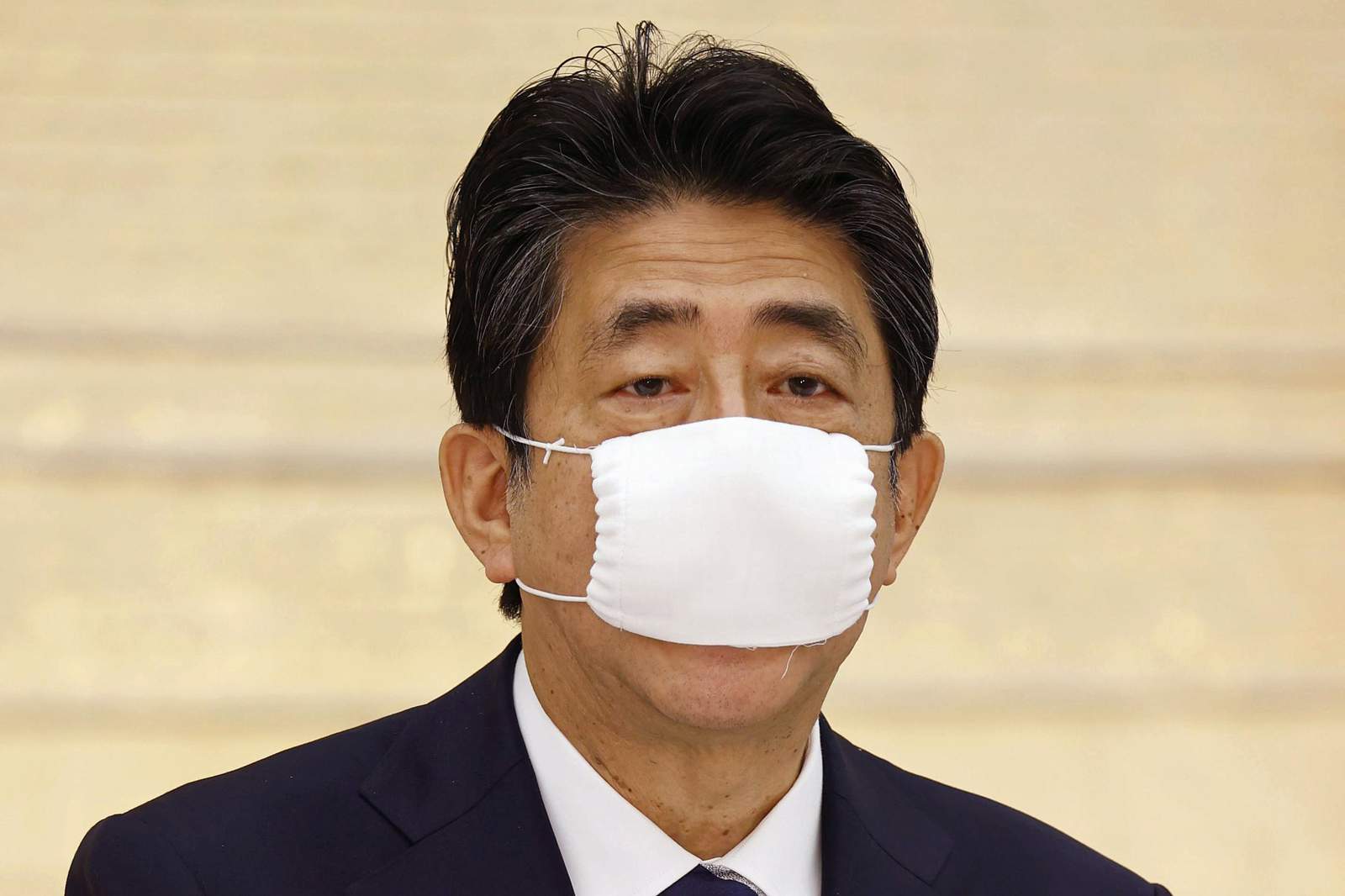 Japan OK's funds for $1.1 T stimulus to fight pandemic woes