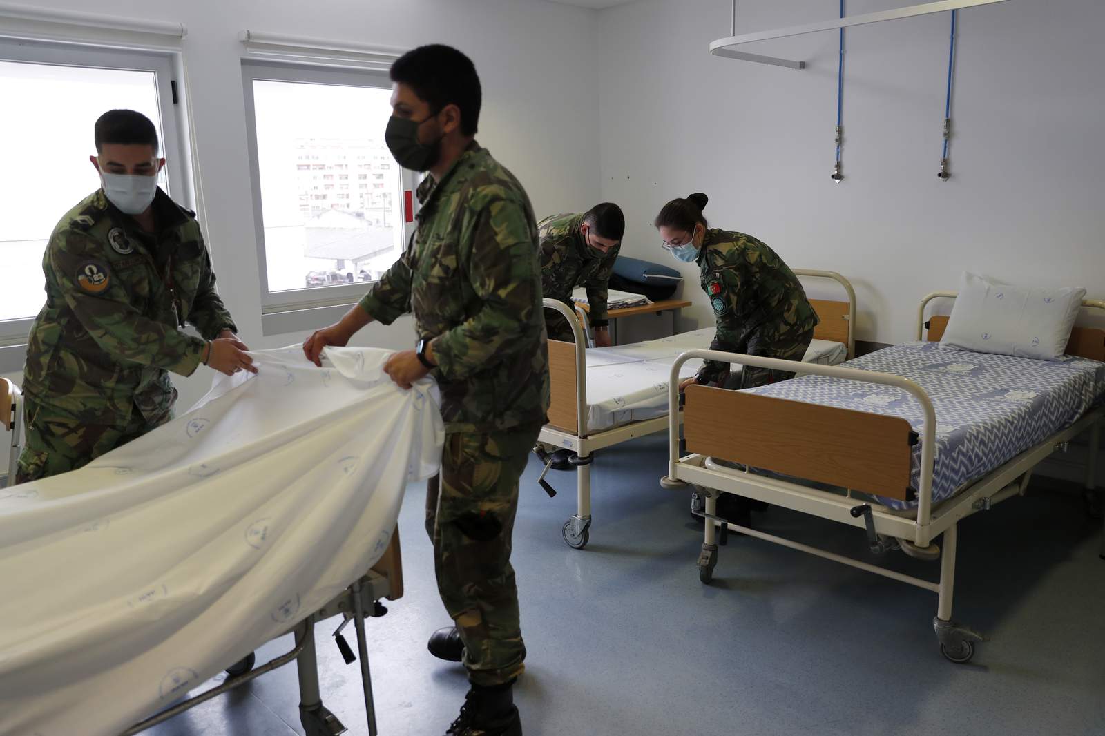Portugal scrambles for virus beds; health system threatened